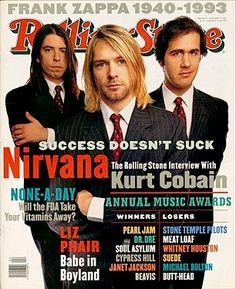 the front cover of rolling stone magazine with nirvana on it's back and two men in suits