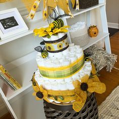 a multi layer cake sitting on top of a basket