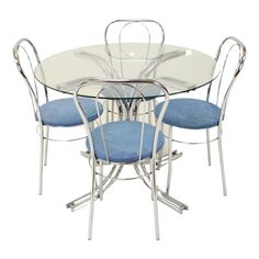 a glass dining table with four chairs and a blue seat cushion on the back side