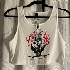 Shein Nwt Women’s L Skate Gang Black/White/Red Tank Top Shirt W/Safety Pin Closure Detail In Front Clean No Damage Stains Rips Snags Edgy White Crop Top, White Crop Top For Streetwear, Edgy White Graphic Print Crop Top, Edgy White Crop Top With Graphic Print, White Cropped Tank Top For Streetwear, Edgy White Cotton Crop Top, White Graphic Print Tank Top For Streetwear, White Cropped Top For Streetwear, White Sleeveless Crop Top For Streetwear