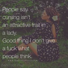 a woman sitting in the grass with a flower in her hair and an interesting quote on it