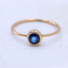 Blue Sapphire Gemstone Ring, 8 US/ 14k Yellow Gold Ring, Gold Jewelry Ring, Faceted Sapphire Gemstone Ring, Statement Ring, Easter Gifts GEMSTONE DETAILS : ✦ Gemstone : Sapphire ✦ Gemstone Shape : Round  ✦ Gemstone Color : Blue  ✦ Gemstone Cut : Faceted ✦ Number of Gemstones : 1 ✦ Gemstone Weight : 0.3 CT's  ✦ Number of Gemstones : 1 ✦ Gemstone Grade: Excellent METAL DETAILS : ✦ Metal : 9K Yellow Gold ✦ Ring Size : 5 US  ✦ Gross Weight : 0.9 Gram  ✦ Setting : Bezel Setting  ✦ Ring Box : Yes CUST Blue Sapphire Ring With 14k Gold Round Band, Sapphire Birthstone Ring In 14k Gold, Stackable 14k Gold Blue Sapphire Ring, Stackable Blue Sapphire Ring In 14k Gold, Blue Sapphire Stackable Ring In 14k Gold, 14k Gold Sapphire Stackable Ring, Sapphire 14k Gold Round Band Ring, Elegant Blue Jewelry With Smooth Bezel, Minimalist Blue Sapphire Ring In 14k Gold