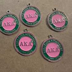 Silver Alpha Kappa Alpha circle charms Pink Green and silver Sold individually (one charms) Customized Silver Medallion Jewelry, Handmade Round Charms For Gifts, Handmade Charms As Gifts, Nickel-free Round Pendant Charms, Metal Round Charms For Gifts, Round Metal Charms For Gifts, Handmade Round Metal Pendant Charms, Handmade Metal Round Pendant Charms, Customized Silver Round Jewelry