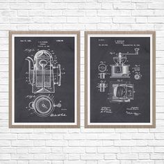 two black and white wall hangings with an old fashioned coffee grinder on them