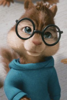 a close up of a stuffed animal wearing glasses