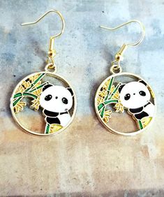 New Handmade Panda Bear Earrings ♡ Colorful enamel Panda Bear charm earrings ♡ Gold tone charm ♡ Gold tone hook back ♡ 1.5 inch long ♡ Hypoallergenic (nickel free) ☆ Matching necklace available in my etsy store Thank you for checking out my online store. I ship within 24 hours of cleared payment Monday-Saturday White Enamel Hoop Earrings For Gifts, Cute Round Metal Earrings, Pierced Dangle Earrings In Enamel, Nickel Free Enamel Dangle Earrings, Cute Round Enamel Jewelry, Gift Enamel Pierced Hoop Earrings, Cute Dangle Enamel Jewelry, Cute Enamel Dangle Jewelry, Nickel-free Enamel Round Hoop Earrings