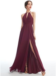 a woman in a long dress with a slit