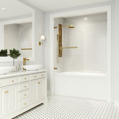 a white bathroom with two sinks and a bathtub in the middle of the room