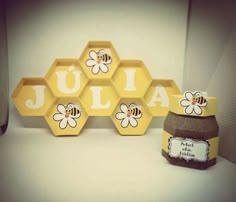 the honeycombs are decorated with bees and name tags