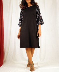 Black tunic dress for women, Linen shift dress, Hand block print dress, Linen tunic dress, Made to order, Custom made, Plus size-Model height: 5'3" wearing size S-Length: 38"-Mirror workHand block printing is a centuries old Indian art form that utilizes a hand carved teak wood block that is dipped in dye and stamped by hand onto cotton or silk. We have used simple floral motifs to create elegant designs for our comfortable shift dresses. Black Cotton Tunic Dress, Black Dresses With Printed Motifs For Festive Season, Festive Black Dress With Printed Motifs, Black Straight Kurta For Summer, Fitted Straight Kurta Block Print Dresses, Fitted Block Print Straight Kurta Dress, Black Cotton Straight Kurta Dress, Festive V-neck Block Print Dresses, Festive V-neck Dress With Block Print