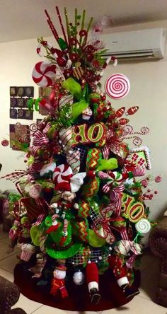 a christmas tree decorated with candy canes and ornaments