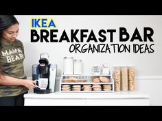 a woman standing in front of a counter filled with donuts and pastries next to a sign that says breakfast bar organization ideas