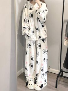 Embrace the charm of Japanese aesthetics with this adorable pajama set, featuring delightful onigiri (rice ball) and star patterns throughout. The top is designed with a cozy hood and a convenient zipper closure, complemented by practical pockets on each side of the placket. The pants boast a comfortable elastic waistband, ensuring a snug fit for a restful night's sleep.  Price includes one pajama set only.   	 		 			Top Size 			S 			M 			L 		 		 			Length 			66.5 			68 			69.5 		 		 			Bust Pajama Pants Aesthetic, Japanese Pajamas, Kawaii Leg Warmers, Onigiri Rice, Kawaii Pajamas, Punk Tops, Pajamas Aesthetic, Punk Skirt, Kawaii Sweatshirt