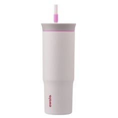 a white tumbler cup with a pink lid and straw sticking out of the top