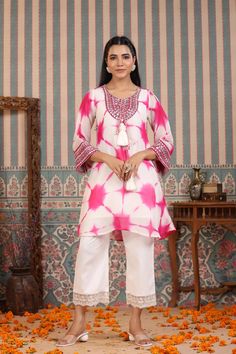 Indulge in elegance with our Pink Tie And Dye Suit Set. The beautiful pink hue and handwork make it the perfect statement piece for any occasion. Crafted from luxurious organza, the delicate tassels add a touch of charm to this unique and sophisticated ensemble. Elevate your wardrobe with this exclusive piece. No. of pieces - 2 piece set. Color - Pink. Kurta Fabric - Organza. Washing Instructions - Dry Clean. Festive Pink Kurta With Handwork, Pink Gota Work Sets For Celebration, Pink Silk Kurta For Party, Pink Kurta With Chikankari Embroidery For Party, Pink Organza Kurta For Wedding, Elegant Fitted Pink Salwar Kameez, Pink Dori Work Kurta For Celebration, Elegant Pink Salwar Kameez With Handwork, Pink Dori Work Sets For Eid