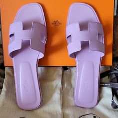 Brand New Authentic Hermes Sandal Lilac Pastel Purple Size 40.5=10.5us, Condition Is New With Box, 2 Dust Bags, Ribbon. Insole Measures 10.35inch Final Sale No Returns Accepted, Know Your Hermes Size. Sandal In Calfskin With Iconic "H" Cut-Out. An Iconic Hermes Style, This Silhouette Is An Essential Piece In Every Wardrobe. Size 40.5=10.5us Pastel Purple Color Made In Italy Bag Matching Shoes, Hermes Enid Sandal, Hermes Oran Sandals Gray, Hermes Esmee Mule, Hermes Slippers, Hermes Oran Sandals, Hermes Style, Purple Sandals, Hermes Shoes