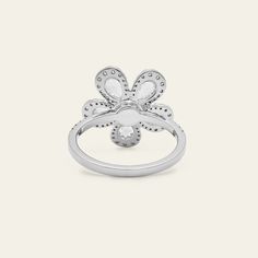 A mix of luminous diamond cuts forms a hypnotic bloom in the Diamond Forget-Me-Knot Ring. Pear-shaped rose-cut diamonds individually surrounded with round diamond halos comprise the petals that emanate from a round diamond center stone. Further diamonds form a partial eternity style on the 18-karat white gold band. Snap up this flower that will never wilt and die. Details18K White Gold1.40 Carats of Diamonds5 Pear-Shaped Rose-Cut Diamonds Totaling 0.81 Carats80 Round Diamonds Totaling 0.59 Carat White Gold Diamond Ring With Flower Shape, Luxury Diamond Flower Shaped Ring, Diamond White Flower Shaped Platinum Jewelry, Diamond White Flower Diamond Ring In Fine Jewelry Style, Fine Jewelry Diamond Ring In Flower Shape, Fine Jewelry Diamond Ring In Flower Design, Diamond White Flower Ring In Fine Jewelry Style, Diamond White Flower Diamond Ring Fine Jewelry, Fine Jewelry Diamond Ring With Flower Shape