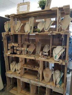 wooden shelves with necklaces and other items on them