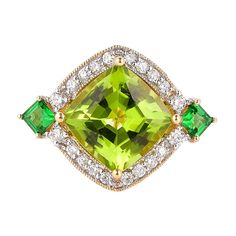 This collection features an array of pretty peridot rings! Accented with diamonds these rings are made in yellow gold and present a vibrant and fresh look. Classic peridot ring in 18K yellow gold with diamonds. Peridot: 4.75 carat cushion shape. Tsavorite: 0.406 carats square shape. Diamonds: 0.574 carat, G colour, VS clarity. Gold: 5.0938g, 18K yellow gold. Ring Size: US 6.75 - Size can be adjusted for free upon request - please reconfirm with your order. R644 Luxury Gold Tsavorite Rings, Luxury Peridot Three-stone Rings, Luxury Unique Peridot Rings, Peridot Rings, Peridot Ring, 18k Yellow Gold Ring, Naha, Fresh Look, High Jewelry