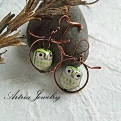 "These handcrafted copper earrings are made with Porcelain owls in a tree holes (except the silver color one). The owls in the tree hole with the copper tree make a fun gift set and look great standing on a dresser. These owls come in different colors and you can also opt for other birds (if available). Please message me for options. These earrings are part of our Prakriti Collection. Prakriti is the Sanskrit word for Nature. This is our largest collection because Nature is so fascinating and in Handmade Copper Wire Earrings For Gifts, Bronze Artsy Earrings For Gifts, Artsy Bronze Earrings For Gift, Handmade Artistic Copper Earrings, Artistic Handmade Copper Earrings, Artsy Copper Jewelry With Matching Earrings, Artisan Handmade Copper Wire Earrings, Artisan Handmade Earrings With Copper Wire, Handmade Artsy Bronze Jewelry