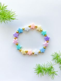 This bracelet comes with pastel colored stars and your choice of bead fillers. Care Instructions: Try not to overstretch bracelets. The string is strong and durable but it can still break if not handled carefully. ♥︎ Beads may tarnish due to oxidation and reaction to body perspiration (which is acidic in nature). The reaction differs from person to person. ♥︎ Please keep the bracelets in a dry & safe place when not in use to preserve the original color of beads. ♥︎ Bracelets with 14k Gold Plated Bracelet Star, Beaded Braclets, Custom Bracelet, Friend Bracelets, Beads Bracelet Design, Handmade Jewelry Tutorials, Beads Bracelets, Star Bracelet, Colour Star