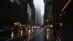 an empty city street at night in the rain