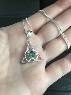 Did you enjoy Charmed, the TV show? I'll fabricate this sterling silver Celtic Trinity Knot pendant, approximately 1 inch in diameter, and I will set your choice of a 6mm round faceted or cabochon gemstone from the drop down menu. This comes with a 16 inch sterling silver box chain at 1.2mm thickness with a lobster claw for secure attachment. This is shown with a classic green Lab emerald faceted gemstone for the lucky lass in you! It's lovely, graceful and elegant...a timeless and classic tradi Celtic Trinity Knot, Celtic Necklace, Symbol Necklace, Moonstone Necklace, Faceted Gemstones, Gold Style, Moonstone, Charm Necklace, Necklace Etsy