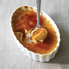 a spoon with some food in it on a table