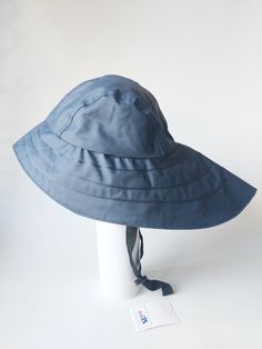 Original North German rain hats with long back brim to protect from rain. Rain Bonnet Vintage, Waterproof Wide Brim Bucket Hat With Adjustable Fit, Waterproof Solid Color Wide Brim Sun Hat, Solid Waterproof Bucket Hat, Waterproof Curved Brim Hat For The Beach, Waterproof Brimmed Beach Hat, Waterproof Wide Brim Sun Hat For The Beach, Waterproof Brimmed Bucket Hat For Travel, Waterproof Wide Brim Sun Hat For Beach