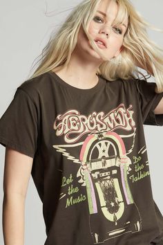 Get into the groove with this retro inspired Aerosmith tee. This shirt features authentic graphics from the band's hit song "Let the Music Do the Talking" released in 1985 from their "Done With Mirrors" album. Our oversized unisex tee is designed with a ribbed crew neckline, short sleeves, and soft cotton fabric for a comfy worn-in feel. Details Style #302753 Color: Vintage Black Aerosmith Let The Music Talk Jukebox Unisex T-Shirt 100% Cotton Care/Import Machine Wash Cold, Tumble Dry Low Designe The Black Crowes, Music Do, Joan Jett, Janis Joplin, Original Fashion, Def Leppard, Aerosmith, Color Vintage, Boyfriend Tee