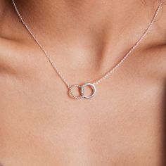 Available in 14K Gold over 925 Sterling Silver Hypoallergenic and antimicrobial Nickel-free and lead-free Boma 925 hallmark is located on the boma tag near the clasp Code: NA 9038 / NAG 9038 Dimensions: approx. 7/8" width x 3/8" height Chain length: adjusts from 16" to 18" Necklaces to layer on beautiful meaning--handcrafted with recycled precious metals. Designed to be worn every day and made with 100% recycled Sterling Silver or Sterling Silver dipped in 14k Gold. Minimal and versatile, this n Jewelry Recycled, Beautiful Meaning, Circular Fashion, Circle Pendant Necklace, Sustainable Jewelry, Circle Necklace, Circle Pendant, Recycled Sterling Silver, Zero Waste