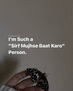 someone holding a butterfly in their hand with the caption i'm such a girl muhse bat karo person