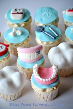 some cupcakes that are decorated like dental instruments