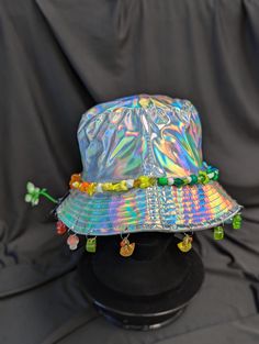 -hat color - silver -bead color - rainbow -charm color - rainbow -unisex adult size -inner circumference - 22.5in -crown dip - 3in -brim - 2.25in -NOT machine washable -Perfect for raves and outdoor festivals! Shipping within the US USPS First Class Package 3-9 days USPS Priority Mail 1-5 days USPS Priority Mail Express 1-3 days Shipping International  USPS First Class Mail International  -Varies- USPS Priority Mail International 6-14 days USPS Priority Mail Express International 3-9 days Shipping times are estimated, NOT GUARENTEED.  +International buyers are responsible for all import fees+ +Orders of $50+ may require signature confirmation upon delivery+ Cheap Multicolor Bucket Hat For Festivals, Cheap Music Festival Cap, Adjustable Rainbow Hats For Summer, Adjustable Rainbow Summer Hats, Festival Multicolor Beaded Hats, Adjustable Rainbow Hat For Festivals, Spring Multicolor Beaded Hats, Whimsical Multicolor Adjustable Hat, Whimsical Adjustable Multicolor Hat