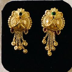 Indian dangling earrings are a traditional and iconic style of jewelry that originate from India and are popular throughout the Indian subcontinent. These earrings are known for their distinctive design, They are a significant part of Indian culture and are worn by women on various occasions, including weddings, festivals, and other celebrations. These earrings are for pierced ears.  Size:  1 inch Note: these earrings are for pierced ears only Occasions: Indian earrings are versatile and can be worn on various occasions, from everyday wear to special events like weddings, festivals, and other celebrations. Care: wipe with clean dry cloth Festive Pierced Jhumkas Drop Earrings, Ceremonial Drop Earrings, Traditional Yellow Gold Chandelier Earrings For Formal Occasions, Ornate Ceremonial Drop Earrings, Pierced Drop Bridal Earrings For Festive Occasions, Traditional Pierced Earrings For Festive Occasions, Temple Jewelry Style Drop Plug Earrings, Festive Chandbali Pierced Earrings, Festive Ceremonial Earrings For Pierced Ears