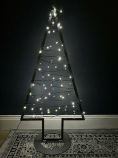 a small christmas tree with lights on it