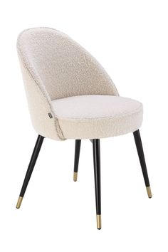 an upholstered chair with black legs and a white fabric seat cover on it