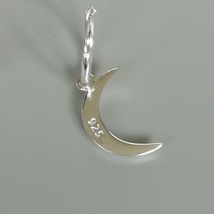 A PAIR of sterling silver 14mm hoops. Comes with a detachable and crescent moon charm. The charm is multipurpose and can be used with a neck or bracelet chain too. Dimension: Hoop- 1.5 x 14 mm Charm-10 x 16.5 mm Drop length- 30 mm Weight: 2.3gm Price is for ONE PAIR. These earrings are made of 925 hypoallergenic sterling silver. Most of my pieces come with a 925 stamp. Can be packaged in a gift box. I can include a personal message from you if needed You are welcome to contact me at... bhavnakwi Celestial Small Hoop Sterling Silver Jewelry, Celestial Sterling Silver Small Hoop Jewelry, Celestial Style Small Hoop Sterling Silver Jewelry, Minimalist Moon-shaped Sterling Silver Cartilage Earrings, Silver Huggie Earrings With Charms In Small Hoop Shape, Silver Sterling Silver Charm Hoop Earrings, Silver Small Hoop Earrings With Charms, Silver Crescent Cartilage Earrings With Moon Charm, Sterling Silver Crescent Cartilage Earrings With Moon Charm