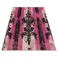 pink and black striped rug with an ornate design