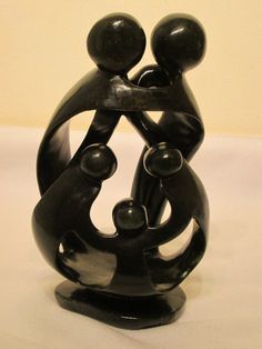 a sculpture of two people holding each other