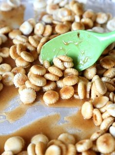 a spoon is scooping some nuts out of the mixture to make peanut butter sauce