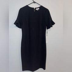 Womens Black Calvin Klein Dress Size 10 Never Worn. New With Tags. Classic Black Midi Dress For Career, Black Career Dresses For Spring, Black Career Dress With Short Sleeves, Black Short Sleeve Career Dress, Black Career Dresses, Calvin Klein Black Dress For Work, Elegant Black Calvin Klein Dress, Calvin Klein Black Workwear Dress, Calvin Klein Black Formal Dress