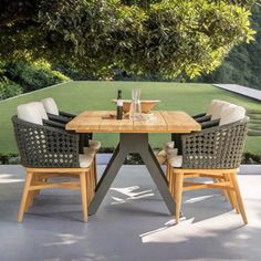 an outdoor table with four chairs around it