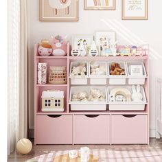 a child's room with pink furniture and pictures on the wall above it, along with toys