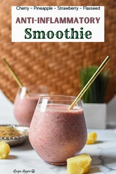 two glasses filled with smoothie sitting on top of a table