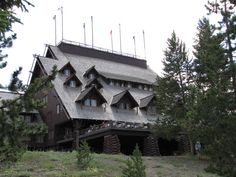 a large wooden building with many windows on top of it