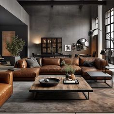 a living room filled with lots of brown furniture and large windows in the wall behind it