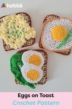 three crocheted toasts with eggs and flowers on them