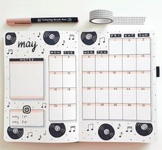 an open planner with music notes on it and a pencil next to it that says may