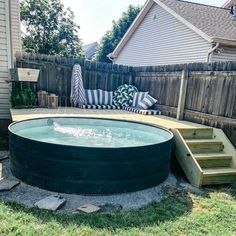 an above ground pool with steps leading up to it and a deck in the background